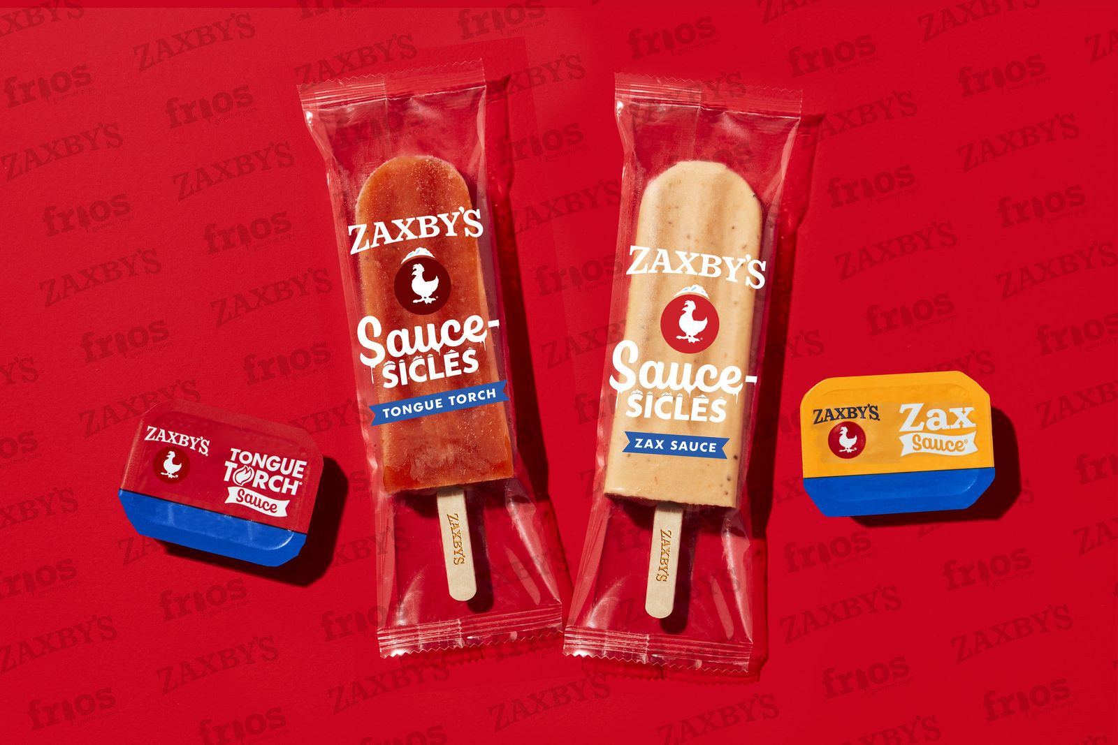 吃起来就像Zaxby's Tongue Torch和红色背景的Zax酱的冰棍，旁边放着蘸料包。＂数据-imagemodel=
